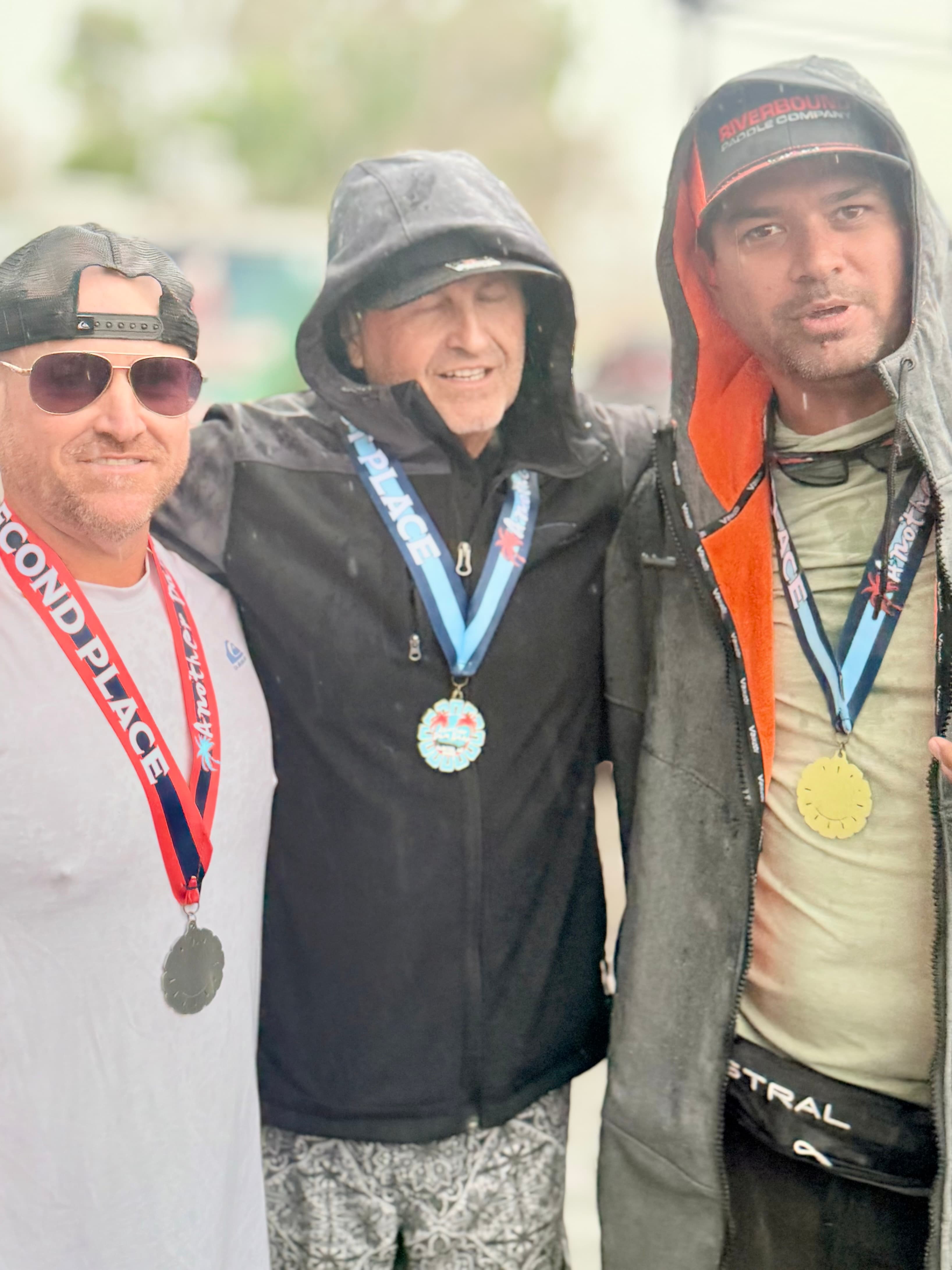 AZ SUP Academy head instructor + race teammates with podium medals